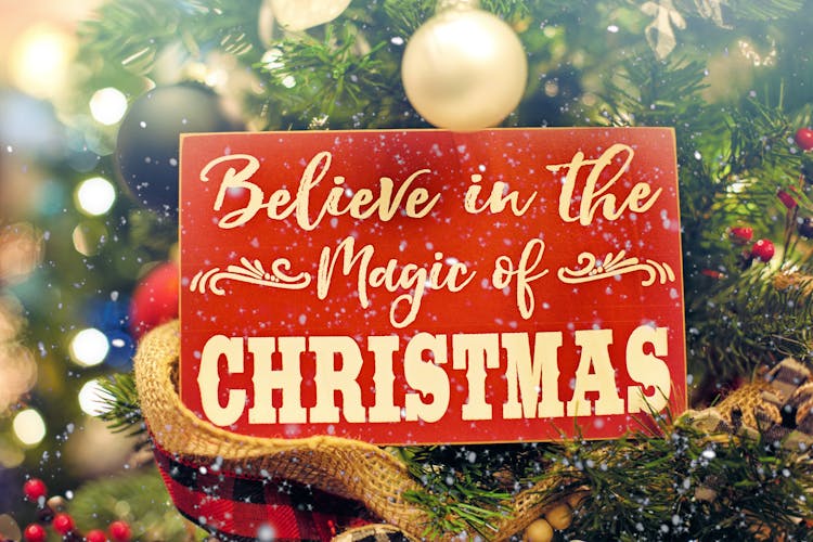 Shallow Focus Photo Of Believe In The Magic Of Christmas Signage