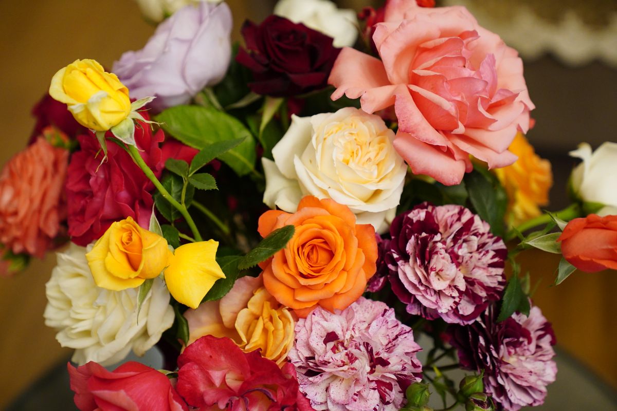 Colorful mixed flower arrangement showing the full rose color spectrum
