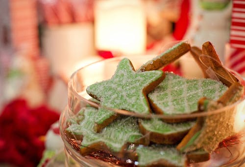 Macro Photography of Green and White Star Cookies in Jar