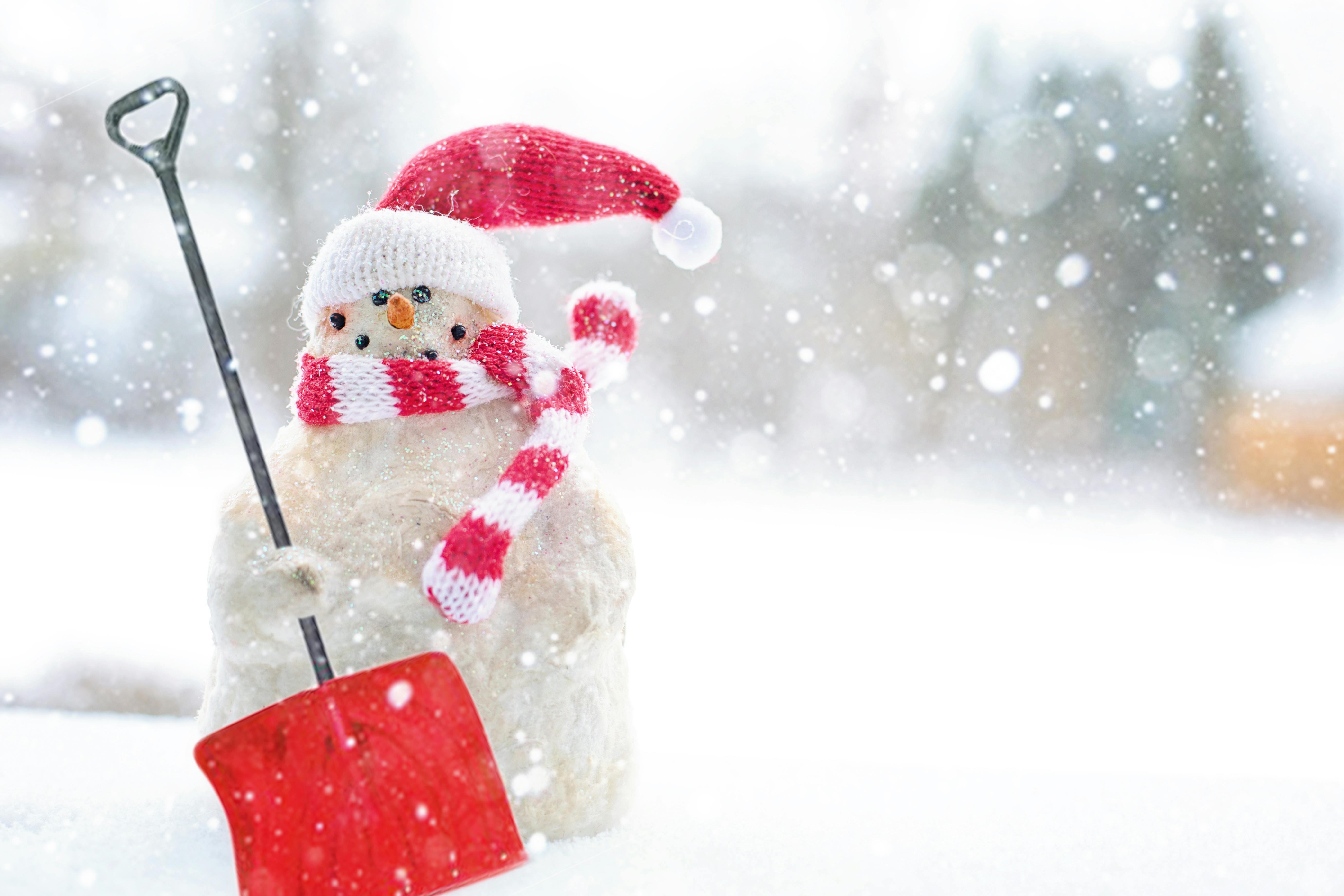 Snowman Holding Shovel · Free Stock Photo