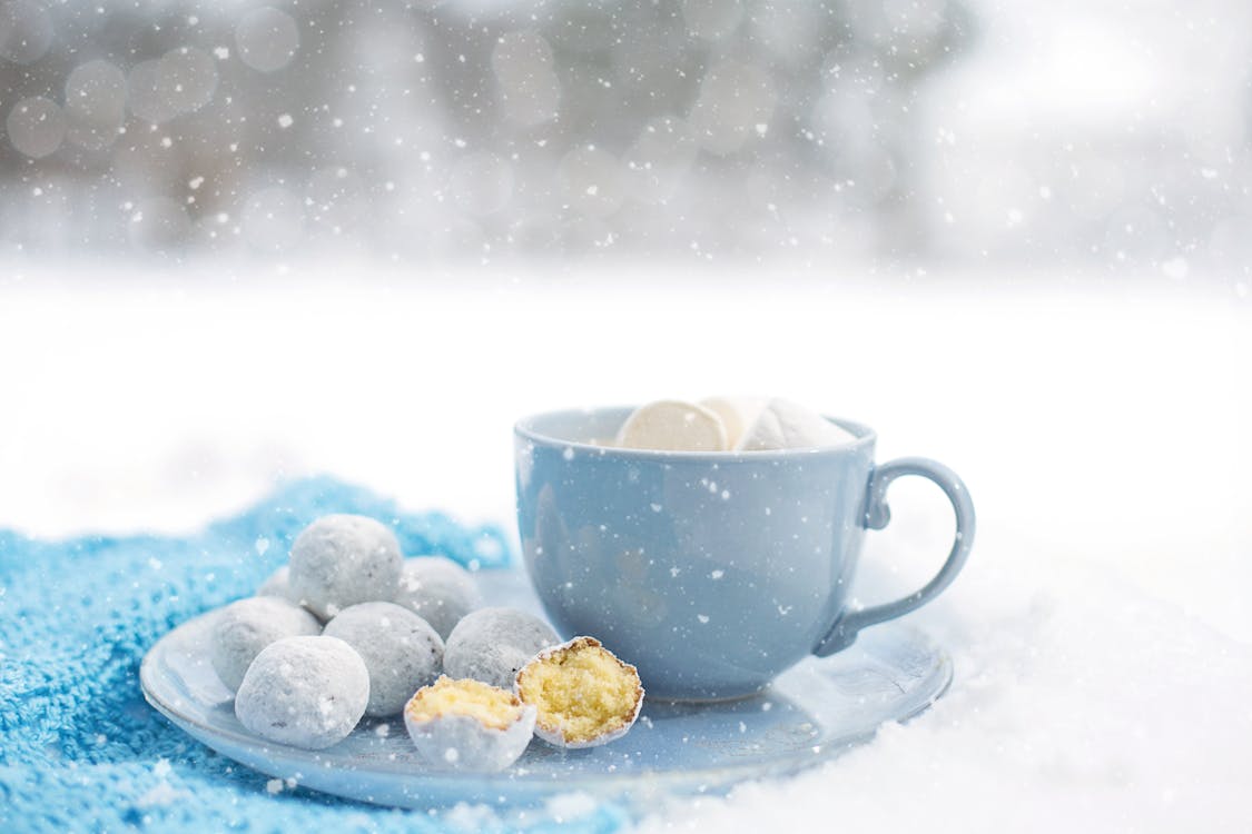 Free Pastries Near Blue Ceramic Mug on Round Plate Stock Photo