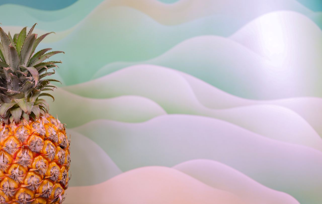 vibrant pineapple set against a soft pastel wave background for a trop