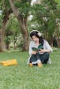 Young Woman Reading Outdoors in Green Park