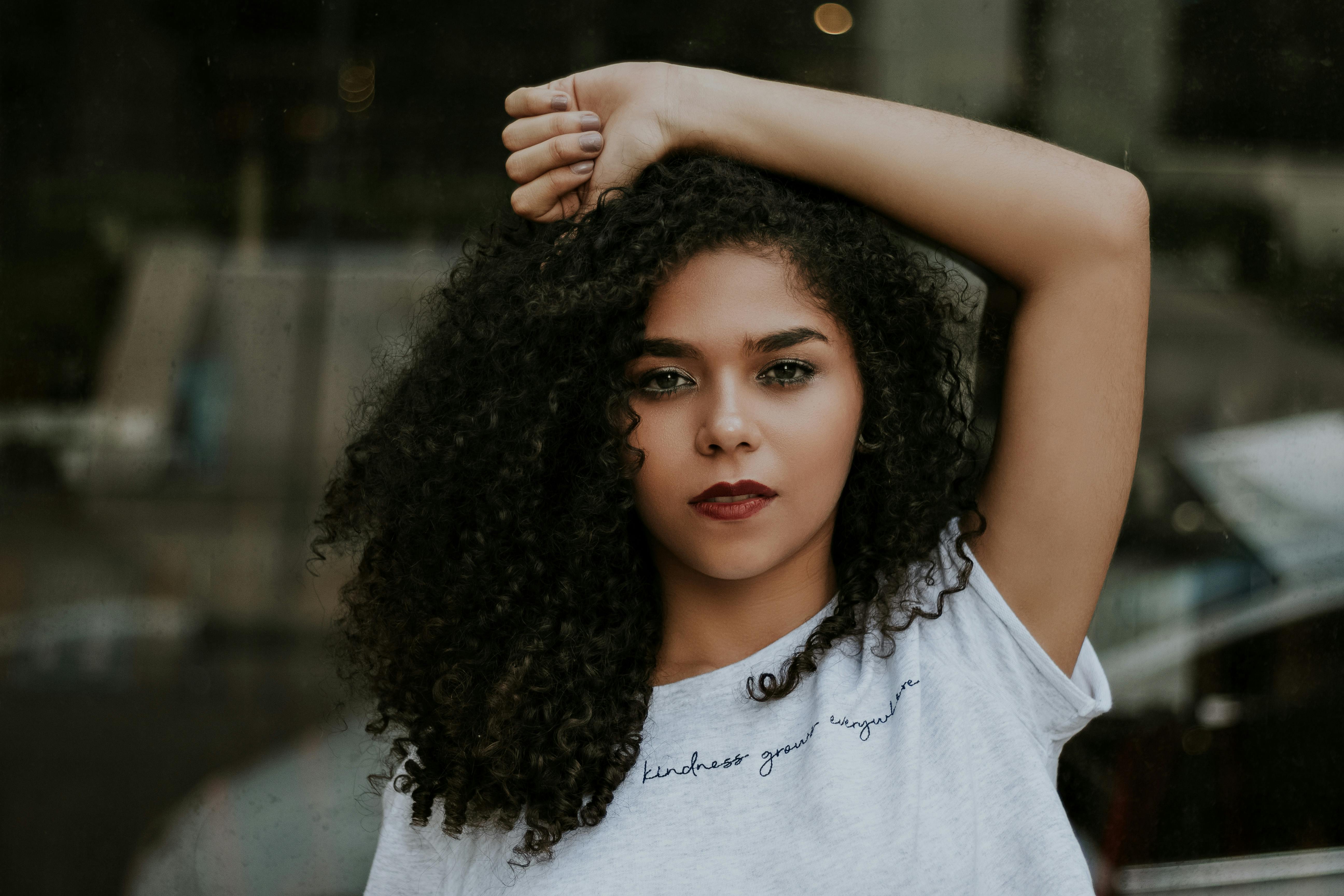 Curly Haired Woman Wearing White Shirt Free Stock Photo