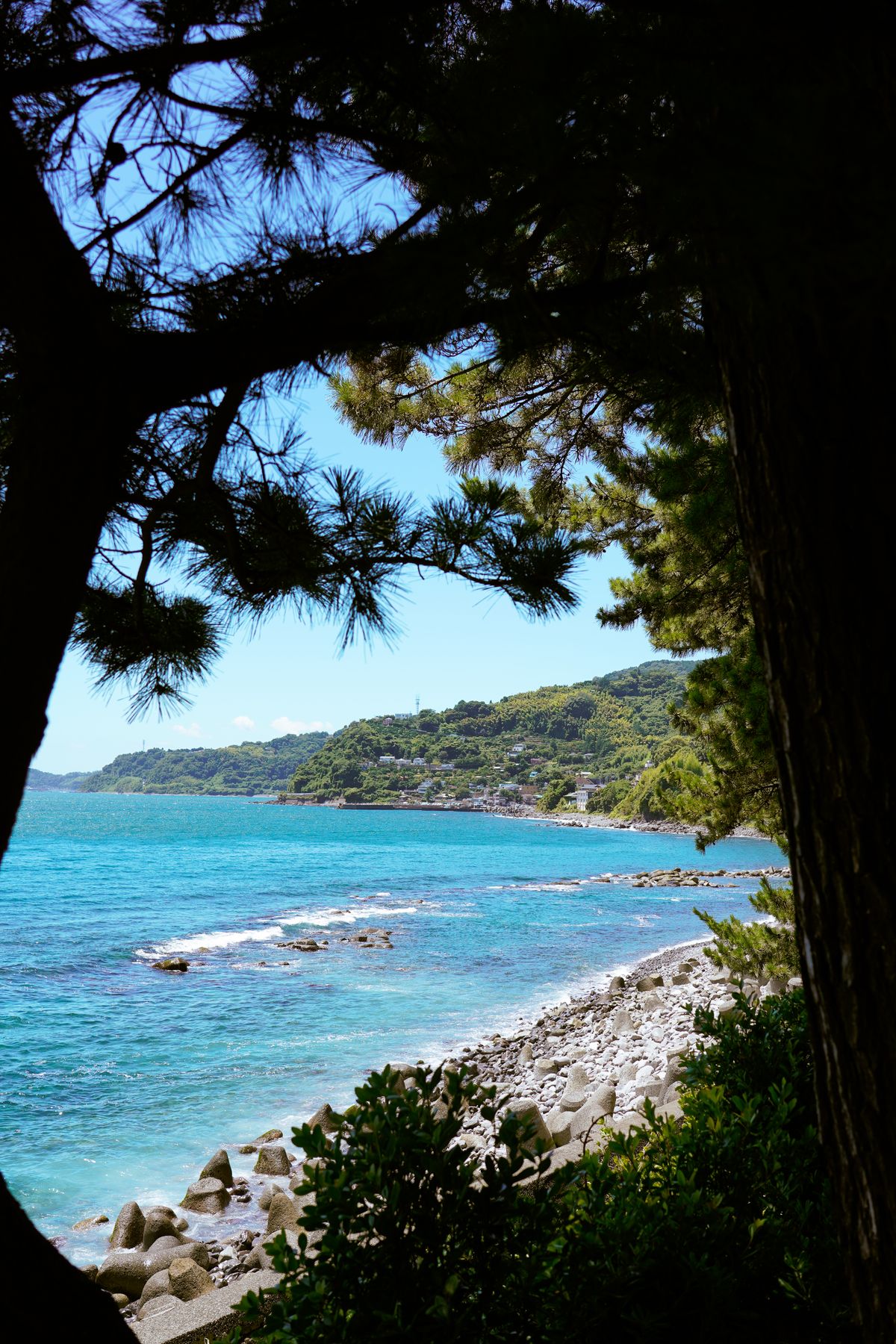 Serene coastline of Atami Japan with vibrant blue waters and seaside views in the Izu Peninsula