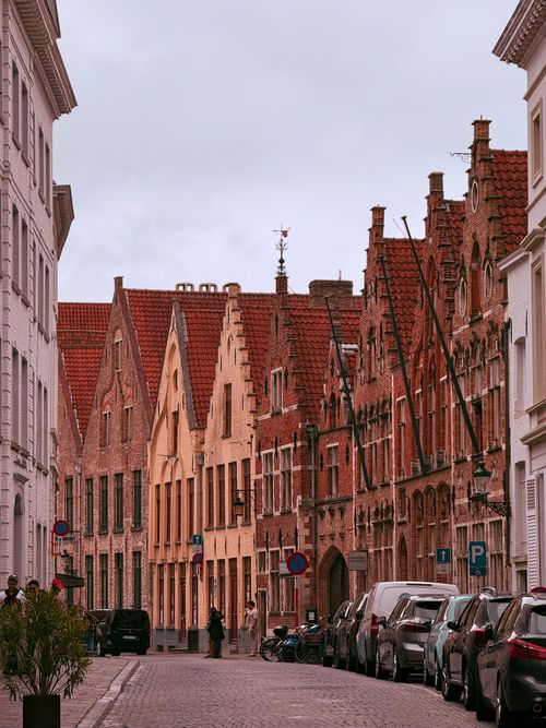 Free Quaint medieval architecture on a picturesque street in Bruges, Belgium. Stock Photo