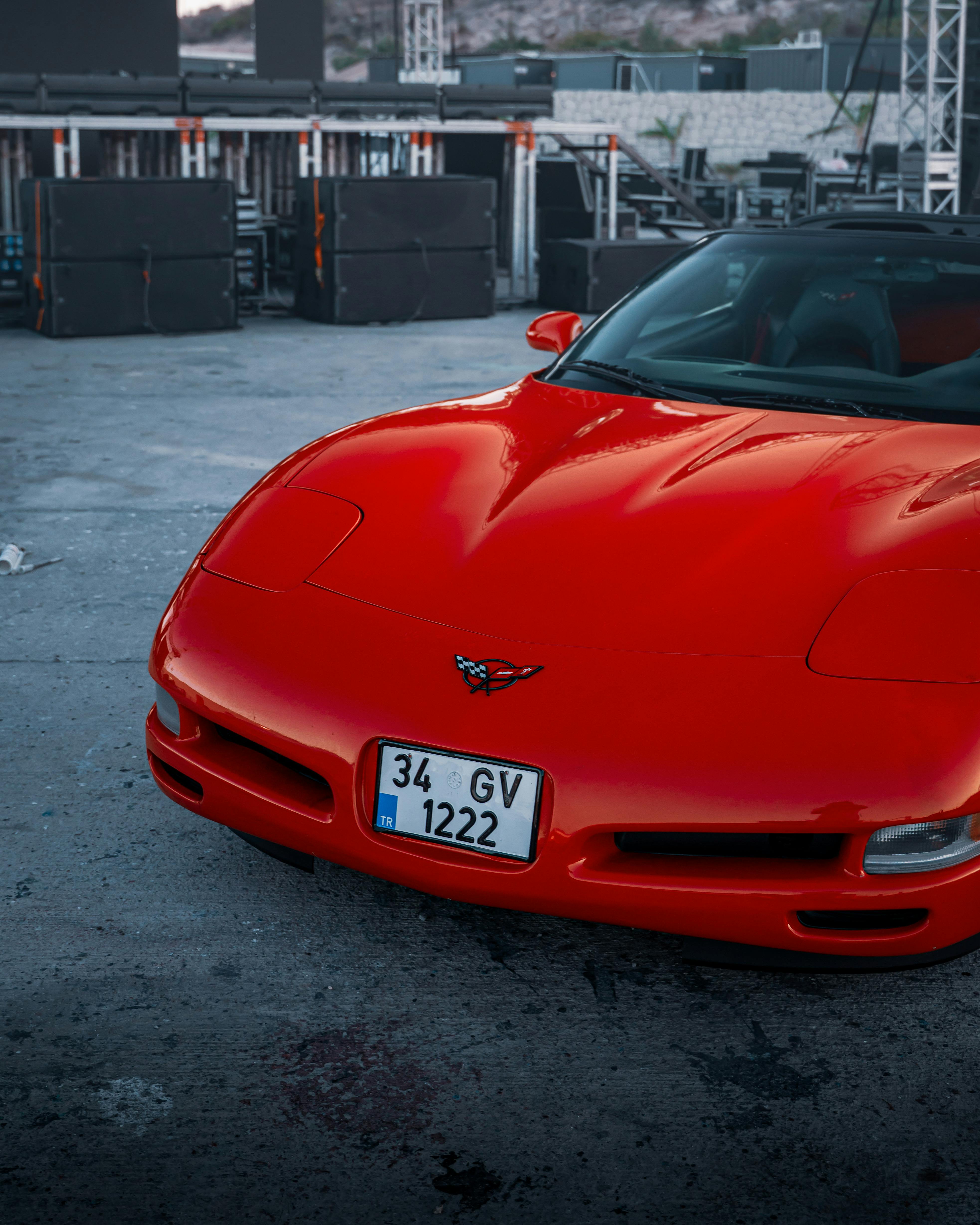 Vintage red sports car parked outdoors in İzmir, Türkiye, showcasing sleek design.