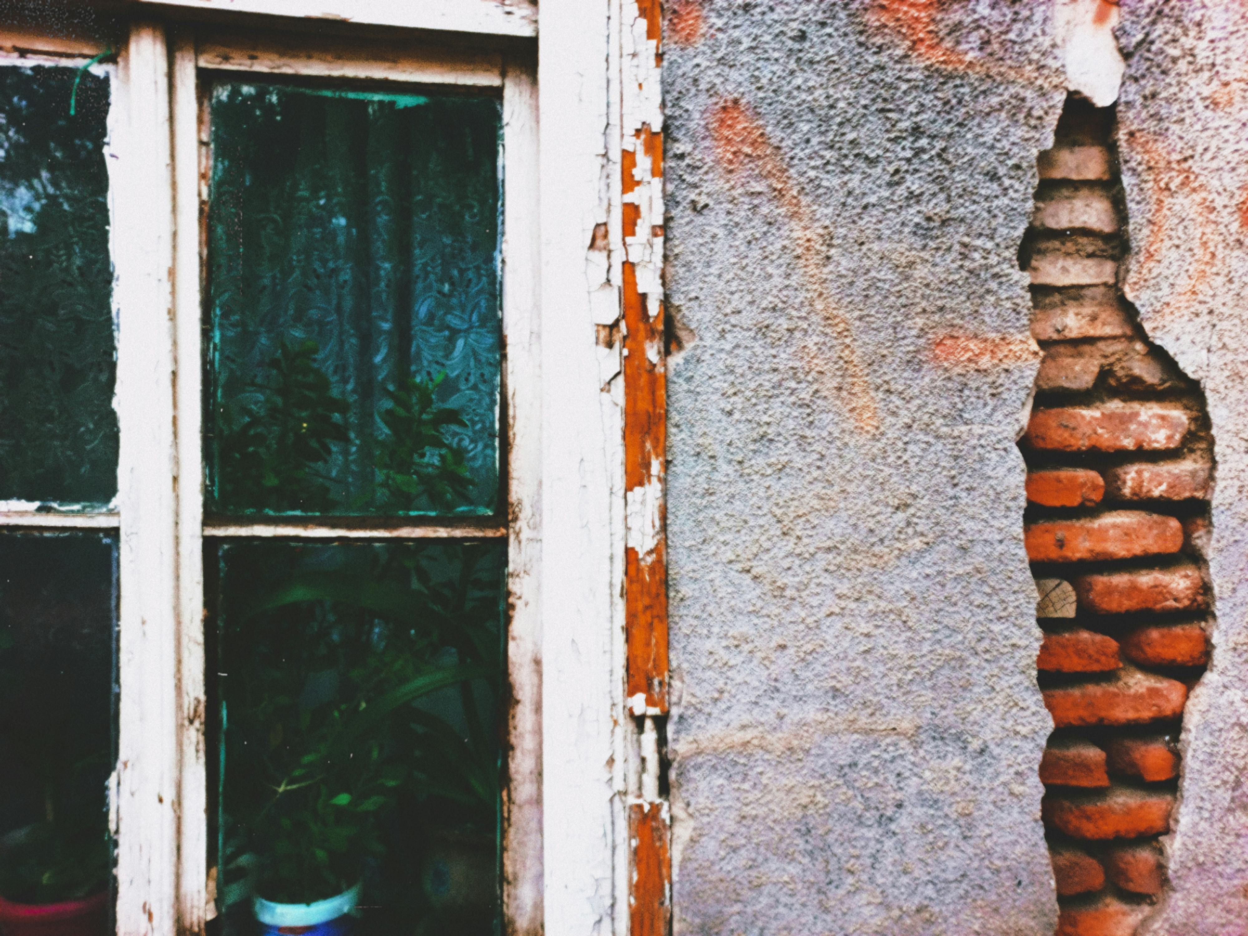 Old Windows With Visible Wear And Tear In A Home Setting