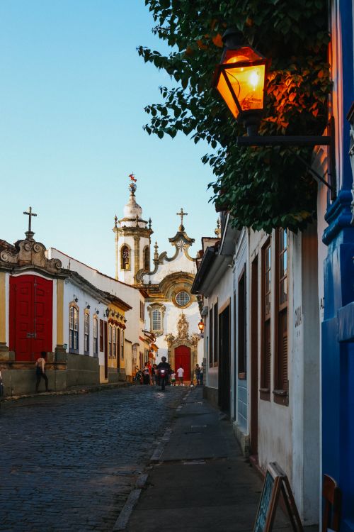 Free Charming street in Ouro Preto featuring colonial architecture under evening light. Stock Photo