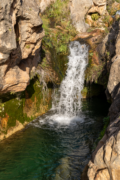 Free Explore the serene beauty of a natural waterfall in Bolbaite, Comunidad Valenciana, Spain. Stock Photo