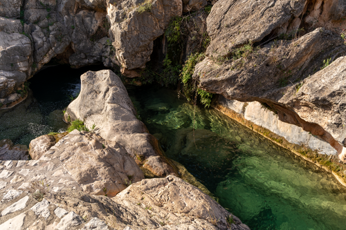 Free Explore the serene natural pools and rocky landscapes of Bolbaite, Comunidad Valenciana, Spain. Stock Photo