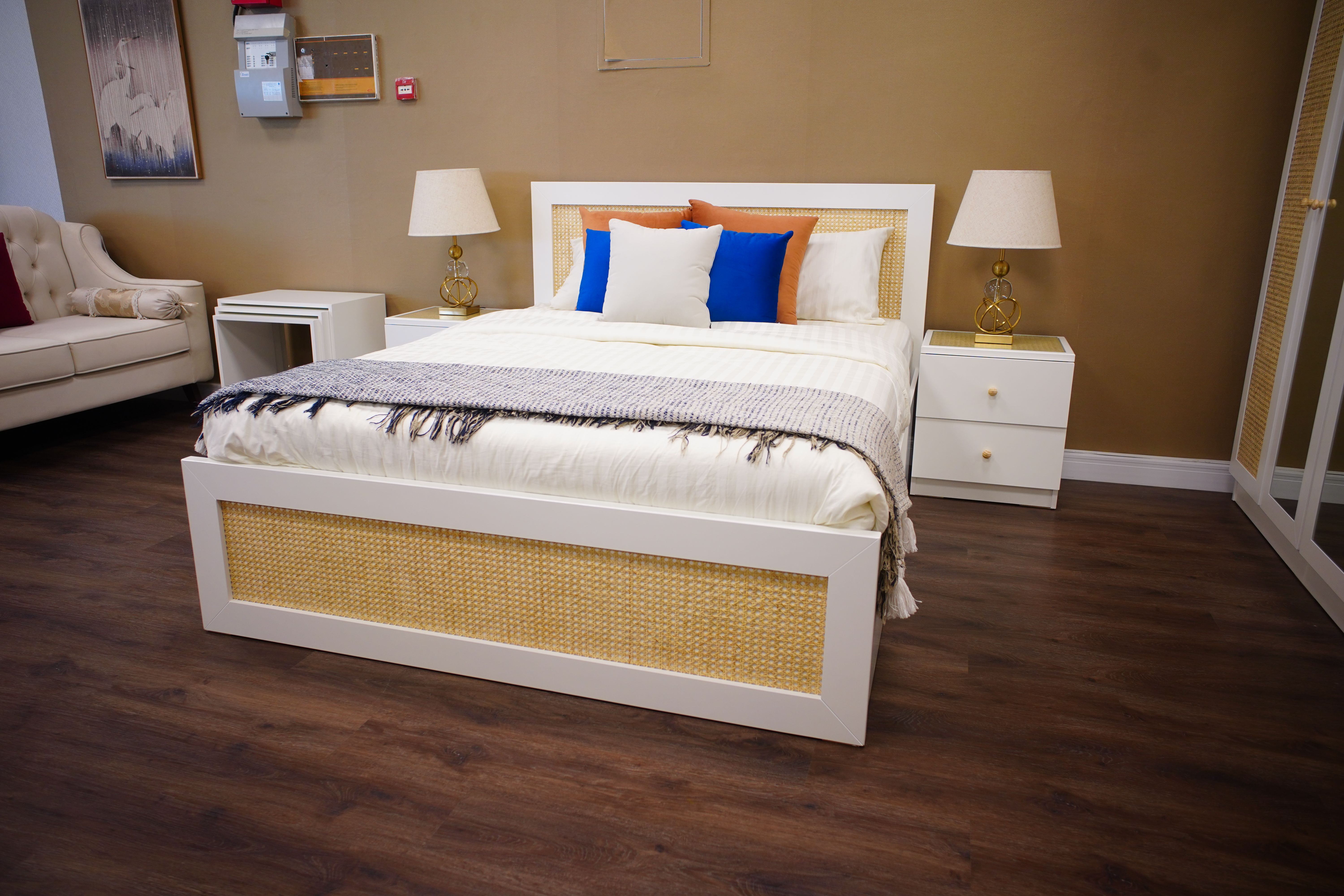 Elegant modern bedroom with luxury furnishings, neutral tones, and warm lighting.