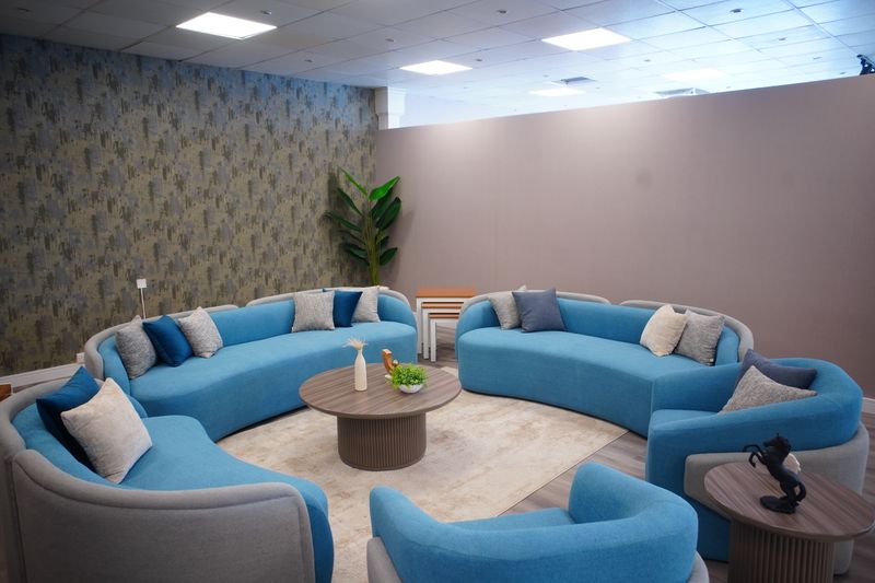 Elegant modern living space featuring stylish blue sofas