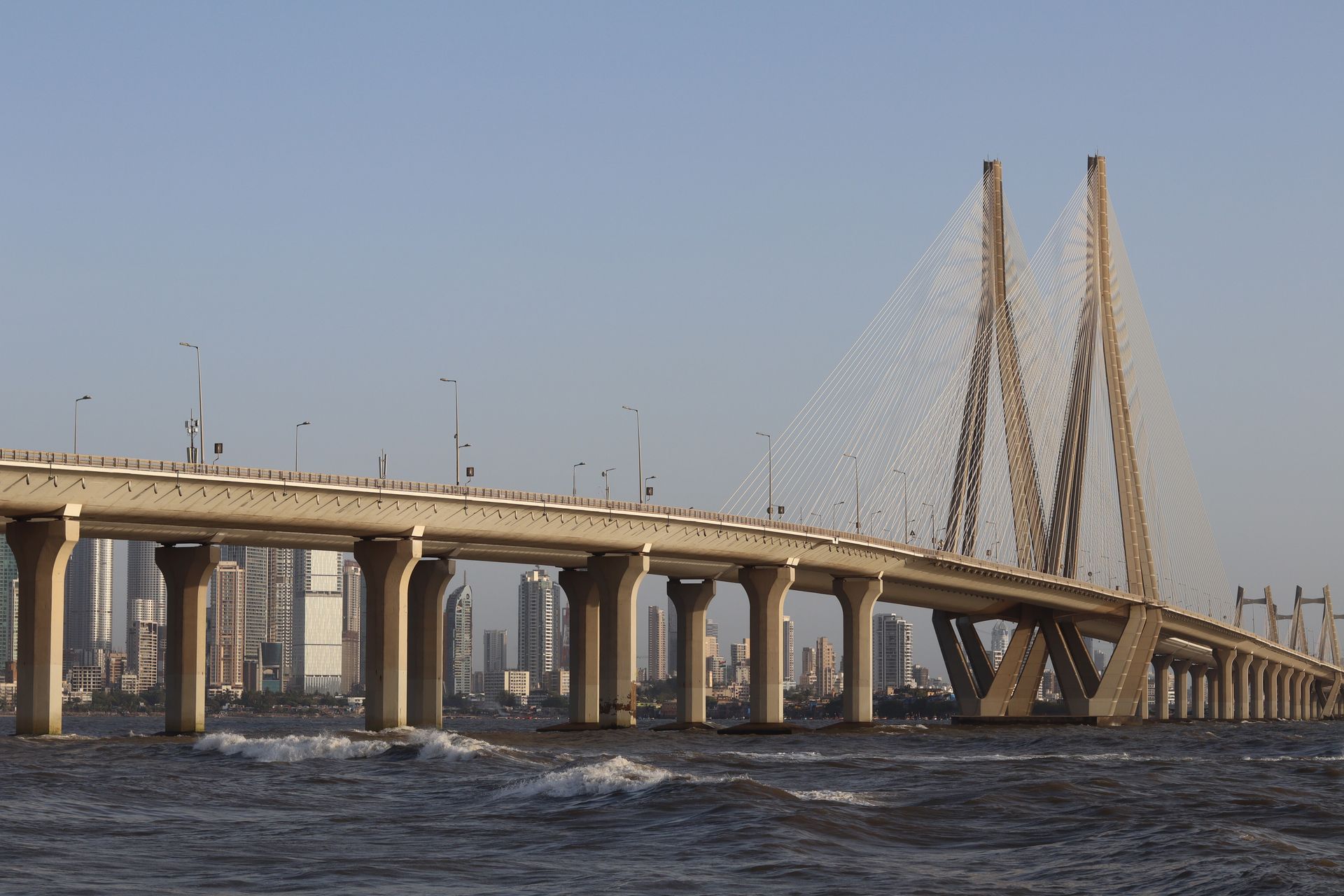 View of the iconic Bandra-Worli Sea Link in Mumbai, showcasing modern architecture against a city skyline.