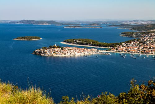 Free Stunning aerial view of Primošten's vibrant coastline and turquoise waters in Croatia. Stock Photo