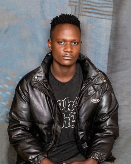 Black faux-leather moto jacket — photo by VYBE FOCUS STUDIOZ on Pexels