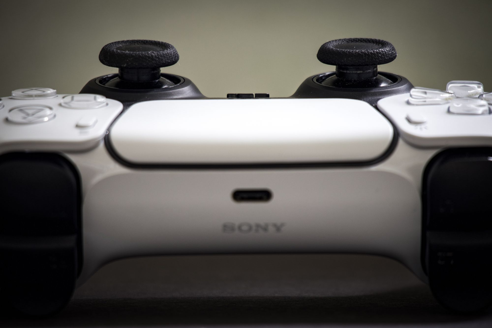 Detailed view of a Sony PlayStation 5 DualSense controller, highlighting design and features.