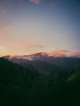 Beautiful sunset over misty mountains in Azerbaijan, capturing a tranquil and serene landscape.
