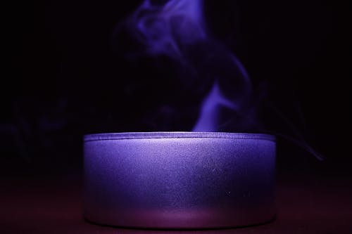 Close-up of Blue Candle Against Black Background
