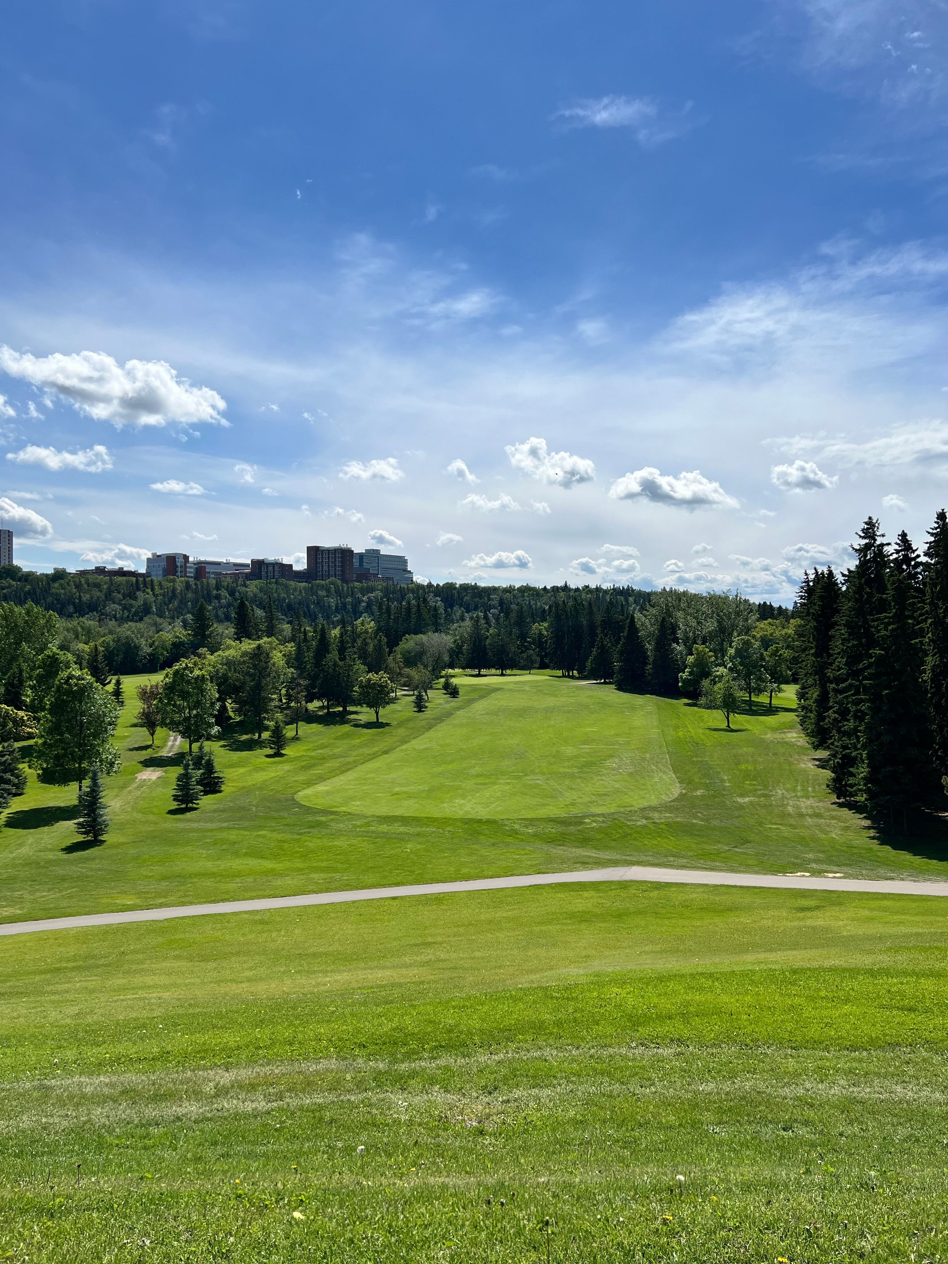 Scenic Golf Course Under Clear Blue Sky · Free Stock Photo