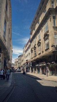 Charming view of a historic street in Istanbul, Turkey, showcasing classical architecture and a vibrant urban scene.