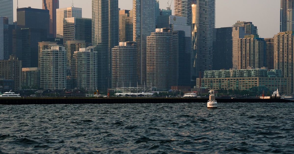 Pre-construction condo towers under construction against Toronto skyline reflecting a cooling condo buyer market