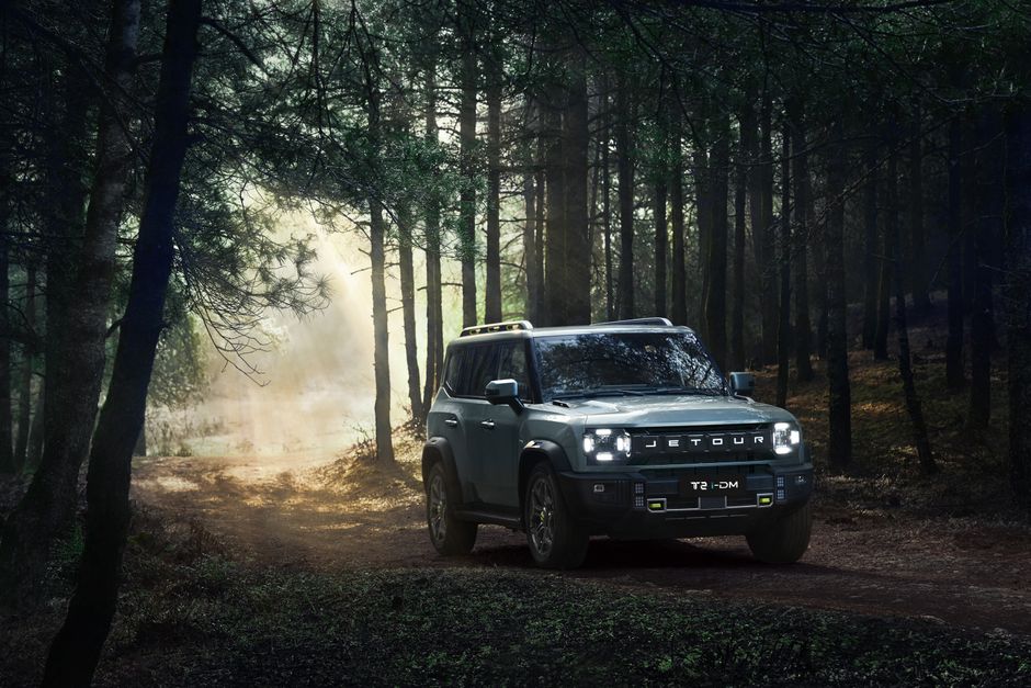 Adventure-ready Jetour T2 SUV driving through a misty forest trail in Georgia. Perfect for off-road exploration.