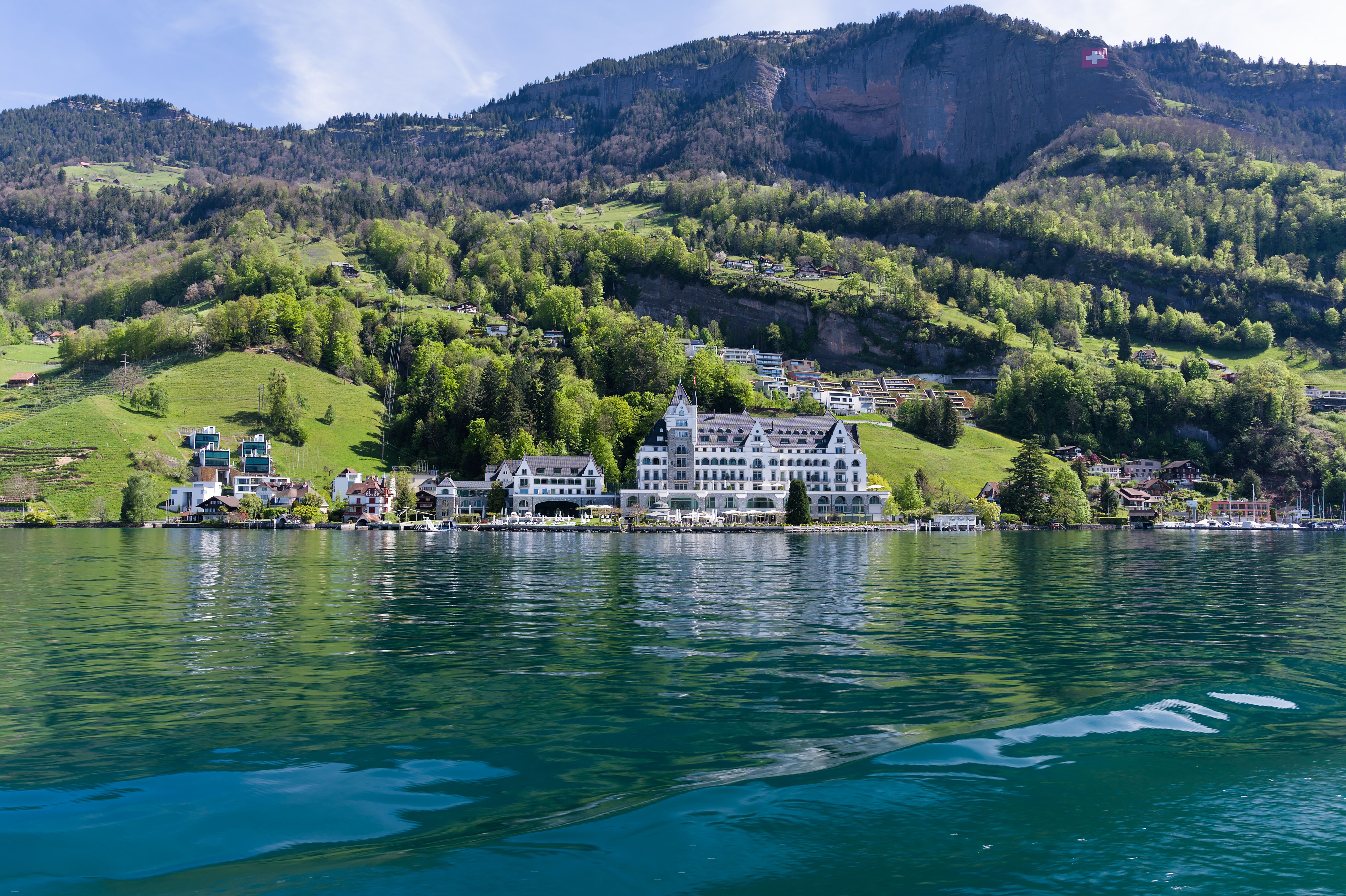 Stunning view of Vitznau, Switzerland, with the Alps and Lake Lucerne in the backdrop.