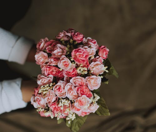 Free Photo Of Person Holding Bouquet Stock Photo
