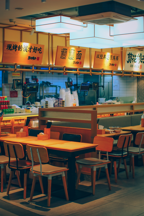 Free Inviting Asian eatery features modern decor and ambient lighting, ideal for dining. Stock Photo
