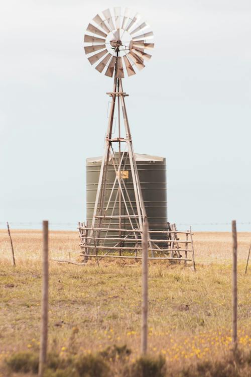 Gray Windmill on Brown Field