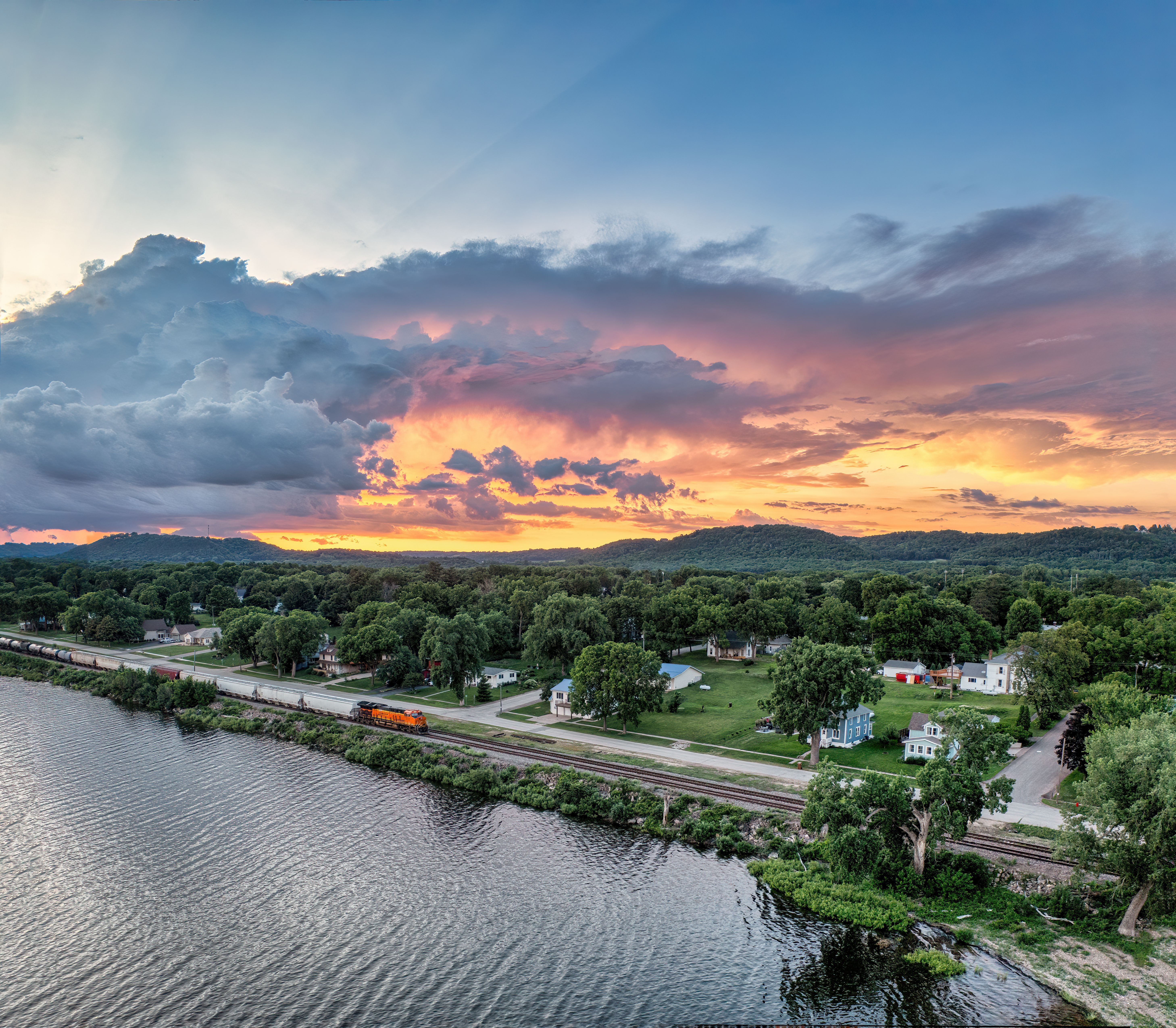 A stunning aerial view of a sunset over the lush landscape of Pepin, Wisconsin.