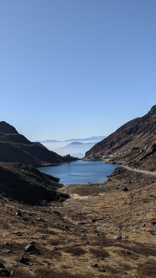 Free Stunning view of a serene mountain lake surrounded by rugged peaks in Sikkim, India. Stock Photo
