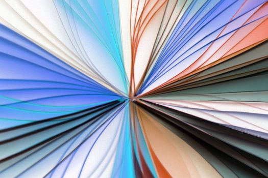 Vibrant abstract image of colorful paper fan design, exhibiting artistic form and symmetry.
