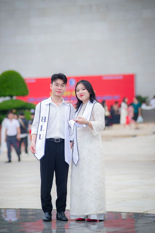 Free Two students celebrating graduation at Hanoi Law University, Vietnam. Stock Photo