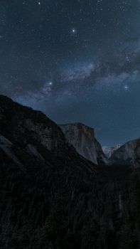 Starry night over Yosemite Valley with visible Milky Way