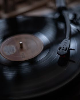 Close-up of a spinning vinyl record on a vintage turntable. Perfect for music and nostalgia themes.