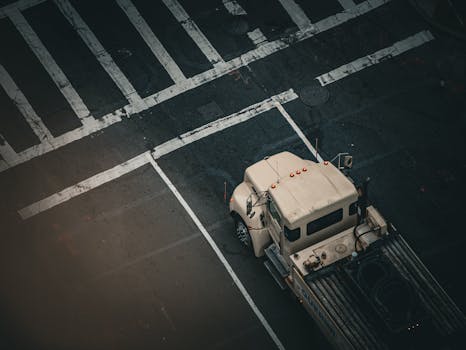 Aerial photo of a truck stopped at a Boston city intersection showing street markings.