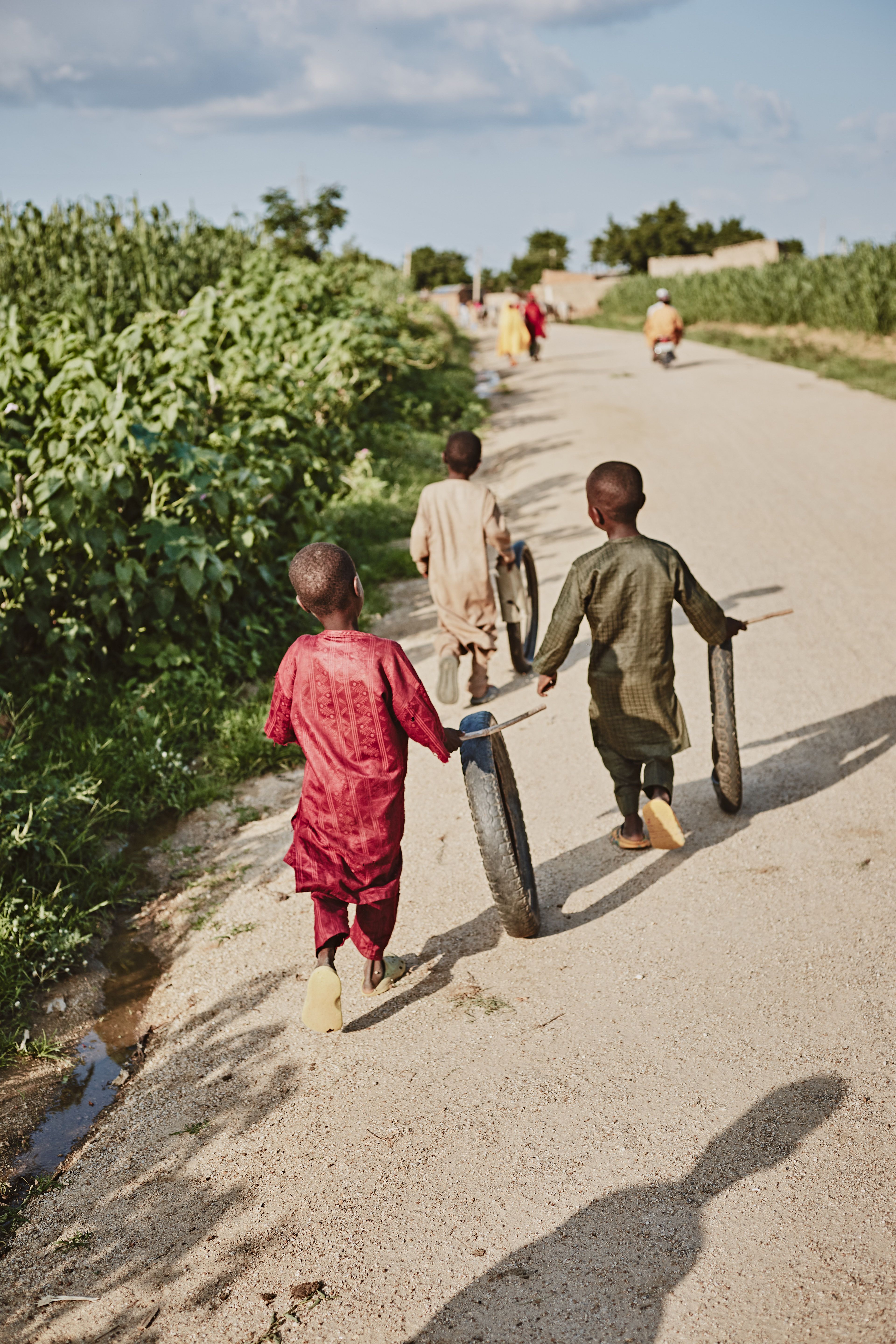 Children in Rural Village Street Scene · Free Stock Photo