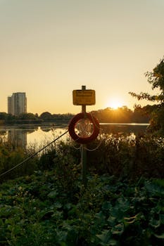 Capture the serene beauty of a sunset over Toronto's lakeshore—a tranquil park scene in vibrant hues.