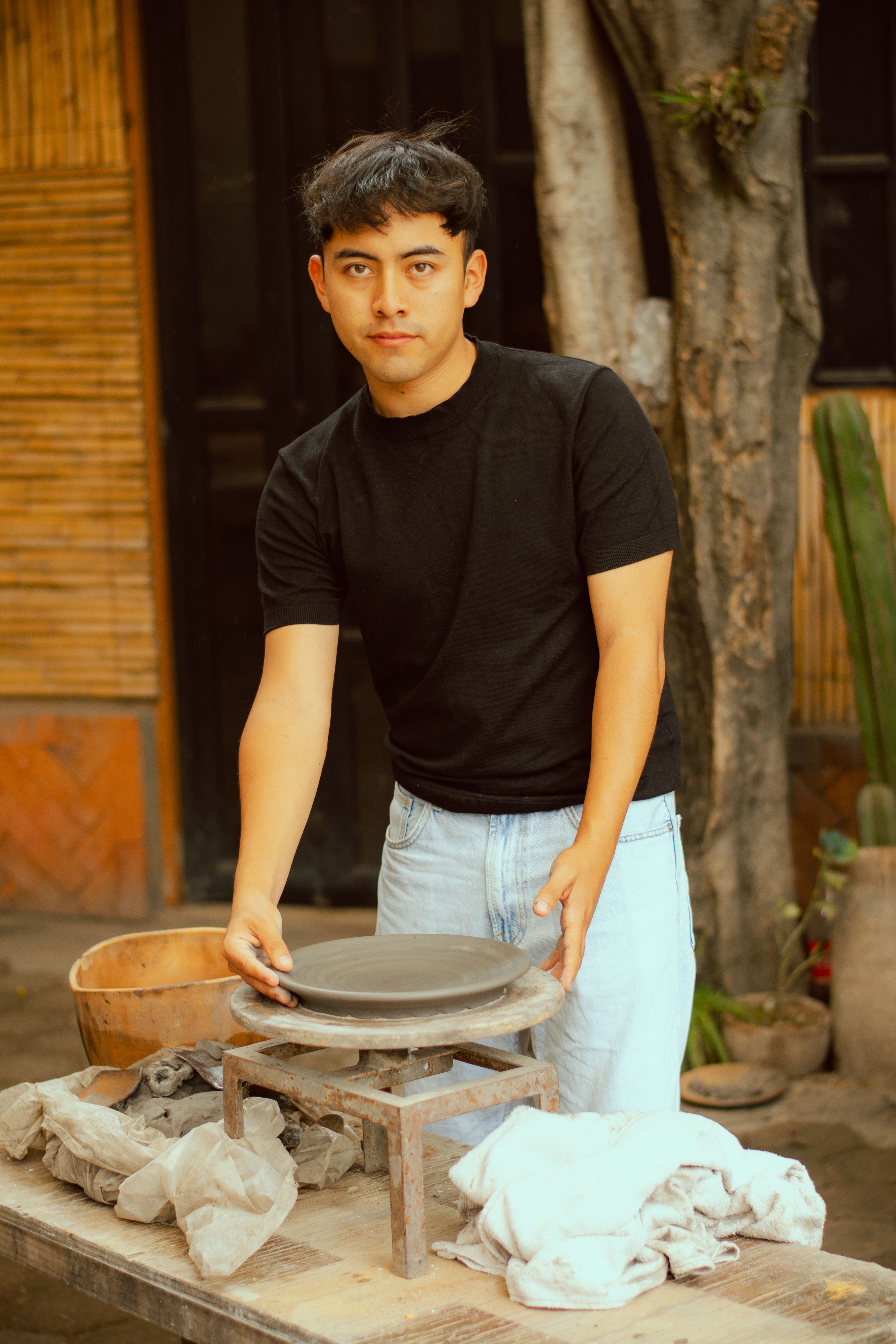 Young Potter Working at Outdoor Clay Studio
