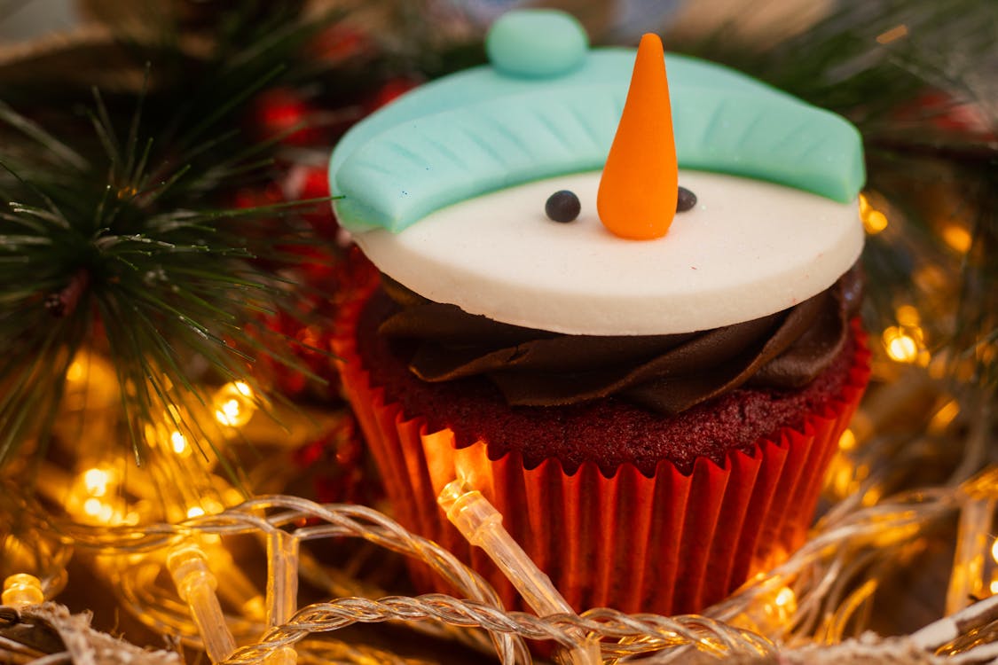 Snowman Cupcake Near String Lights