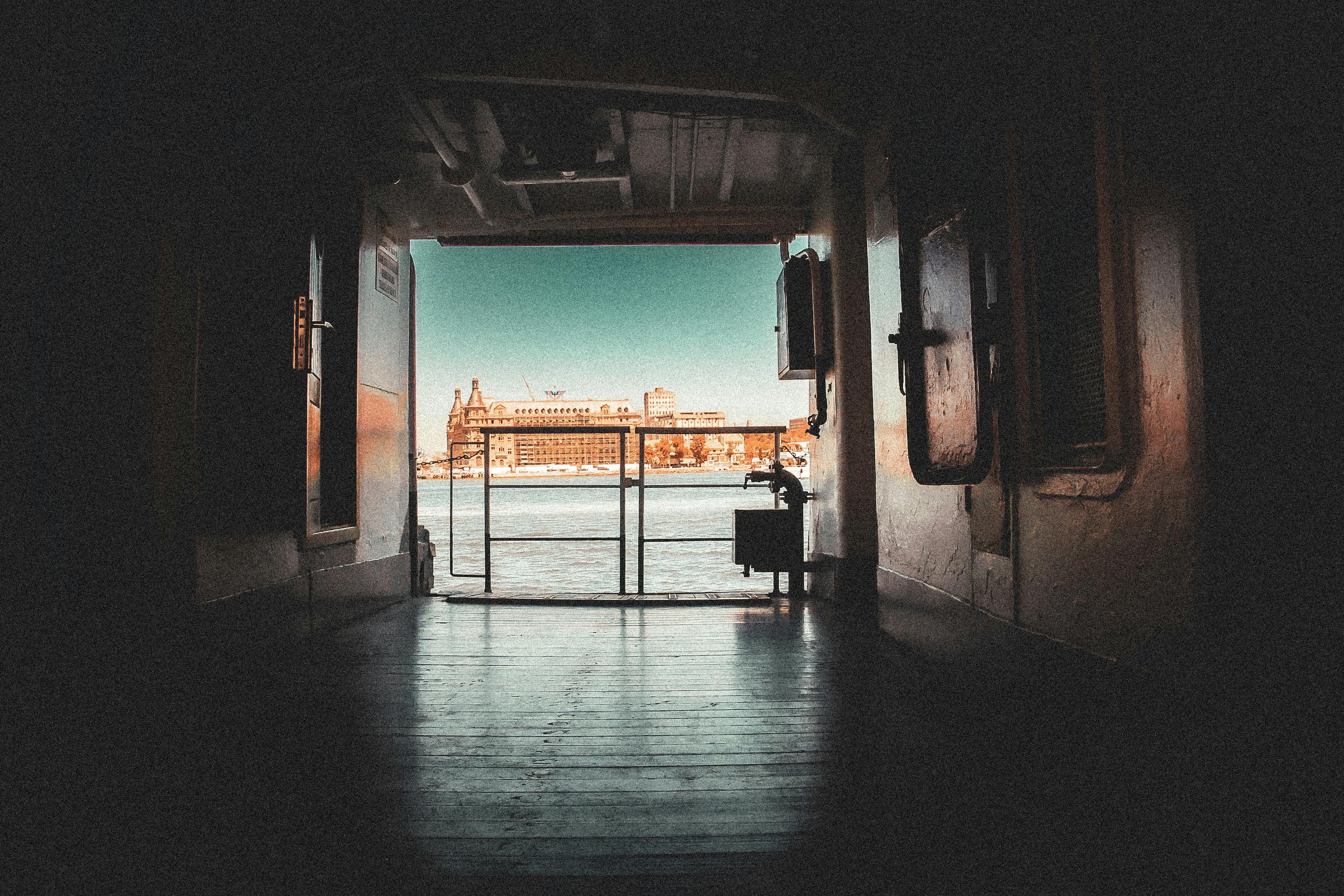 Free View from a ferry passageway towards a city skyline across the water. Stock Photo