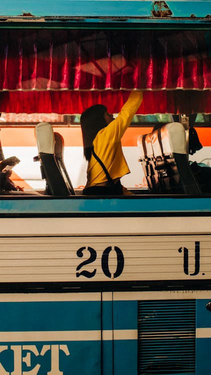 Free Woman Sitting Inside a Bus Stock Photo