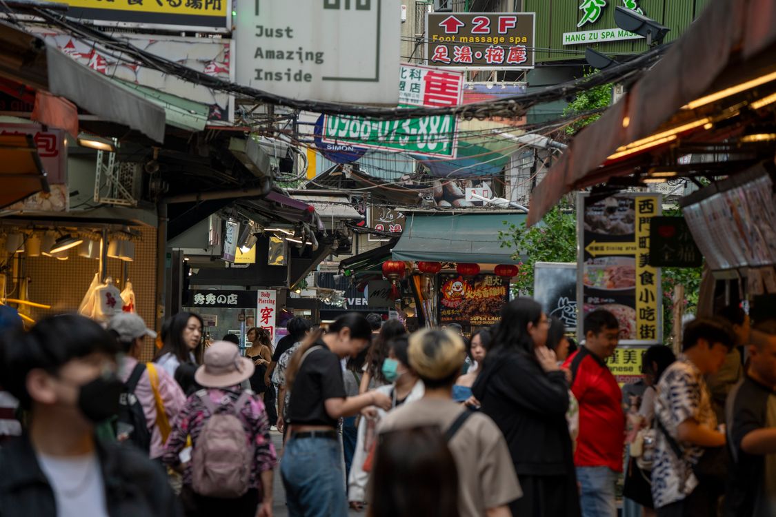 Free A busy and vibrant street market scene in Taipei City, Taiwan, showcasing local culture and activity. Stock Photo