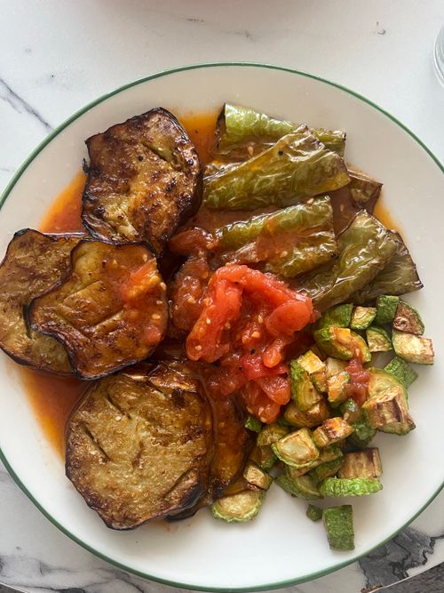 Free Colorful plate of grilled eggplant, stuffed peppers, and zucchini. Stock Photo