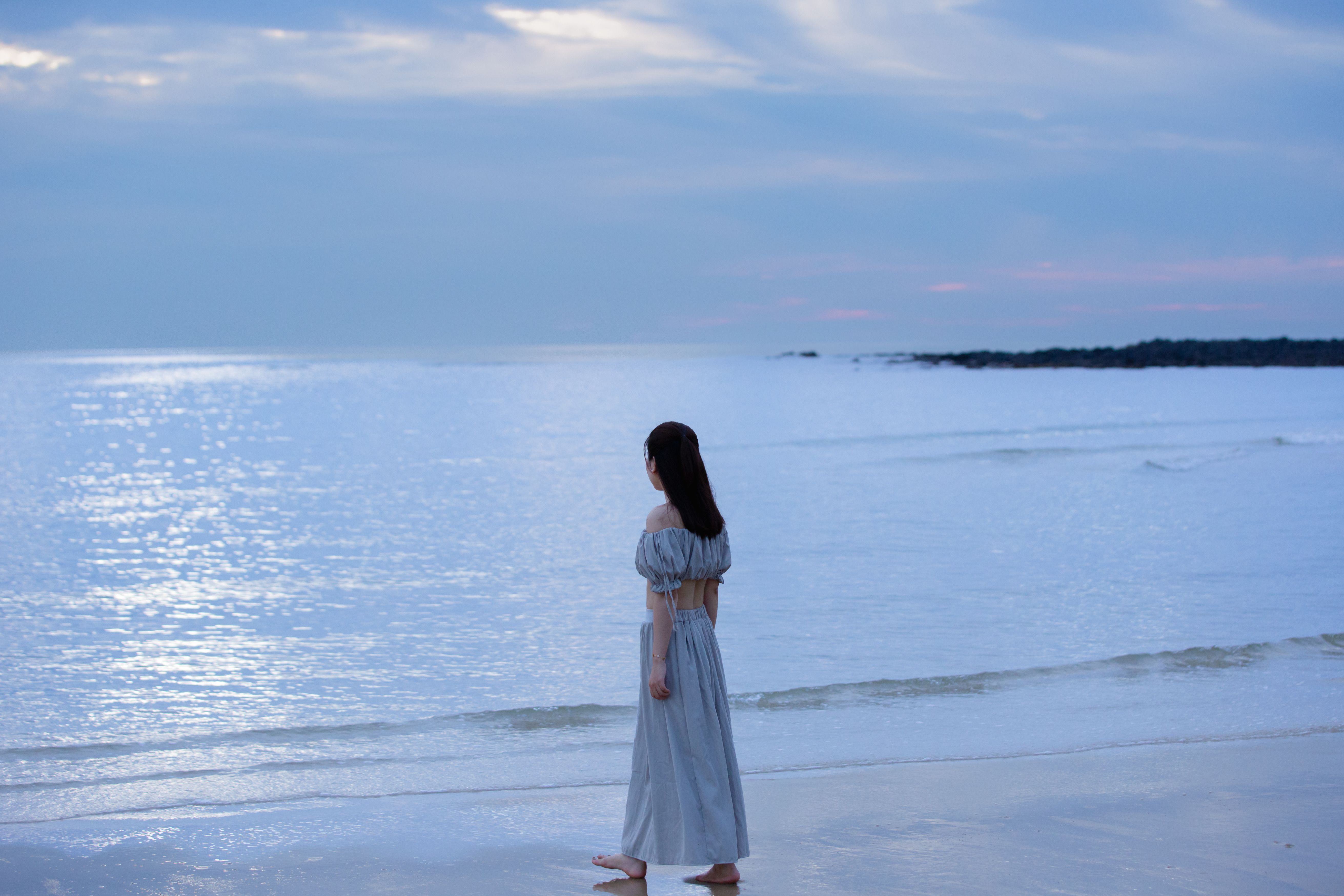 A Woman in White Dress Standing on the Beach · Free Stock Photo