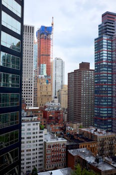 View of diverse architectural styles in New York City with skyscrapers and historic buildings.