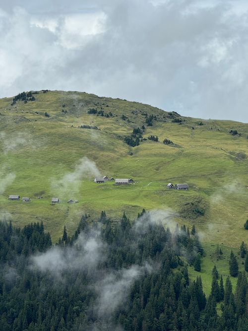 Free Idyllic alpine scene with verdant hills and misty atmosphere. Stock Photo