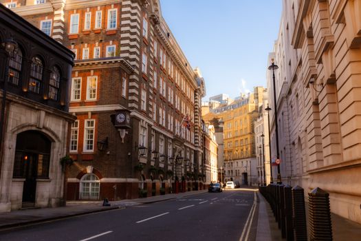 Explore a quaint and historic street in central London, showcasing iconic British architecture.